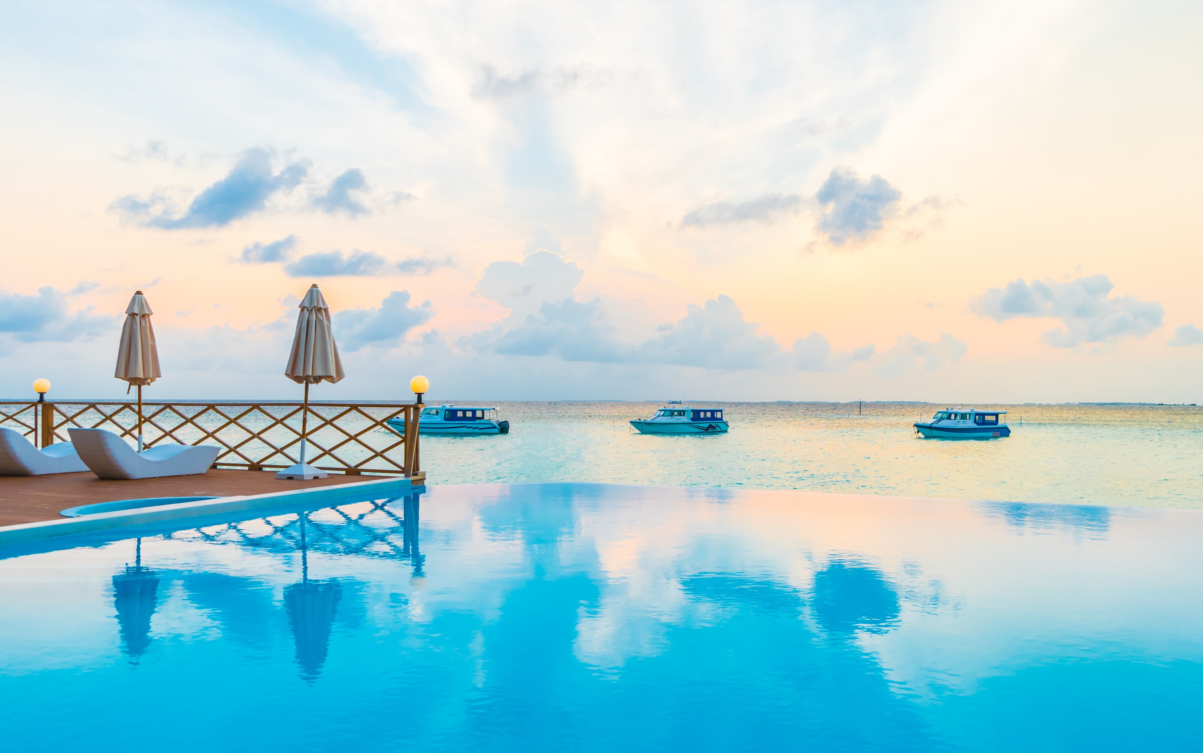 A tropical seaside resort with an infinity pool